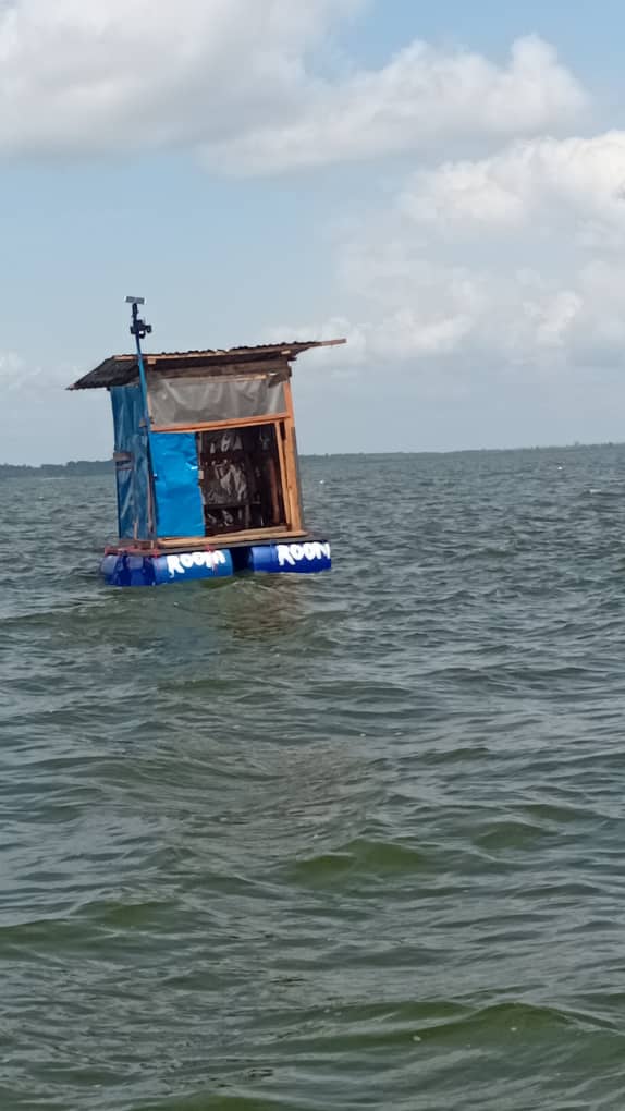 Floating fish farm structure on a lake in Uganda
